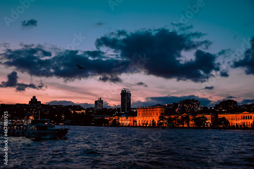 city skyline at sunset, ship sailing, cloudy sunset, turkey travel, night trip