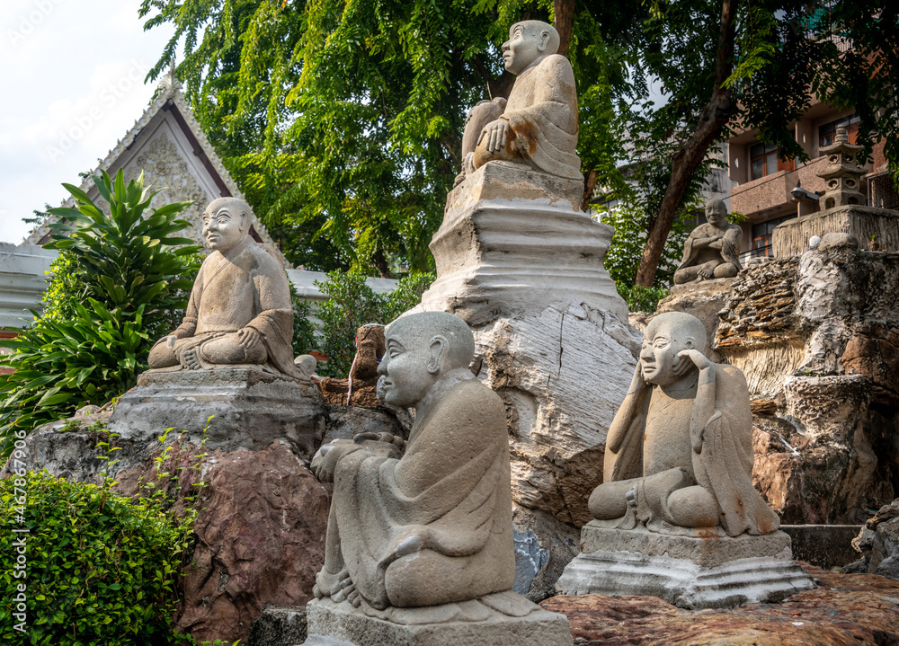 Statue garden at Wat Suthat Temple in Bangkok Thailand