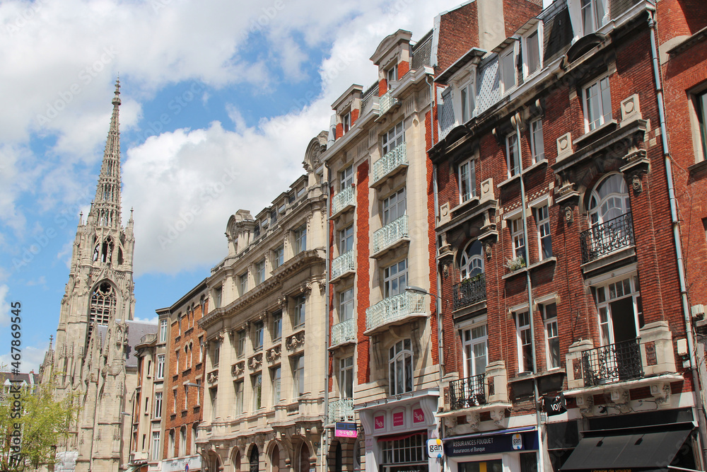 ancient flat buildings and church - lille - france