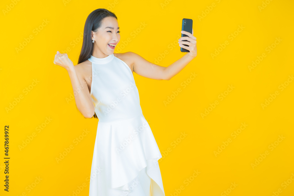 Portrait beautiful young asian woman smile with smart mobile phone Portrait beautiful young asian woman smile with smart mobile phone