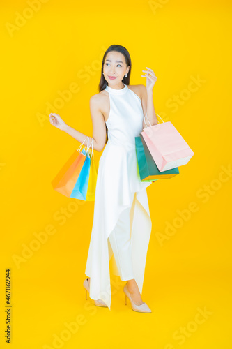 Portrait beautiful young asian woman smile with shopping bag