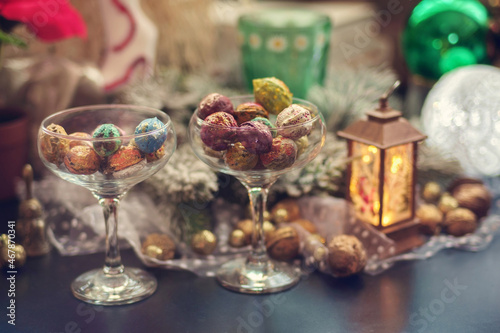 Fototapeta Naklejka Na Ścianę i Meble -  Holiday Christmas decoration still life with colorful walnuts, selective focus