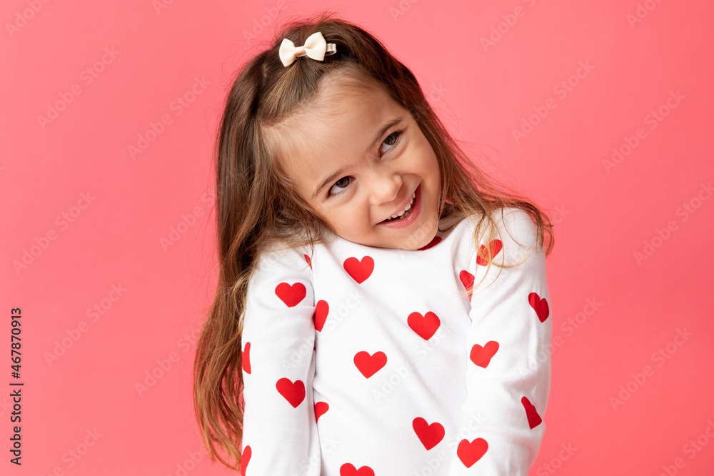 © Lisa Tichané - Little girl on pink background making cute shy smile © Lisa Tichané - Little girl on pink background making cute shy smile