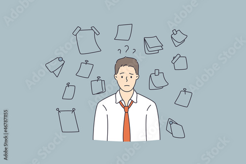 Having much work and duties concept. Young stressed man worker cartoon character standing feeling frustrated with variety of notes papers on wall vector illustration 