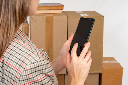 woman with phone sits next ...