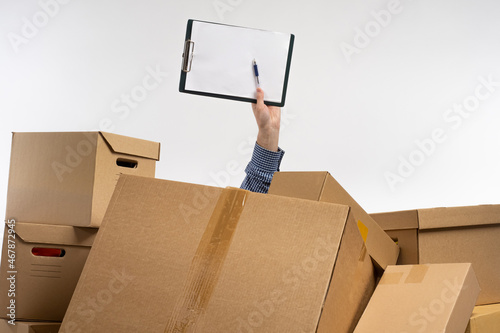 Clipboard in hand of man. M...