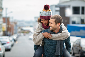 Multiethnic couple having fun in winter