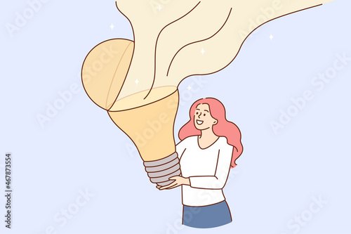 Creativity and great idea concept. Young smiling woman cartoon character standing holding huge light bulb with flying blame vector illustration 