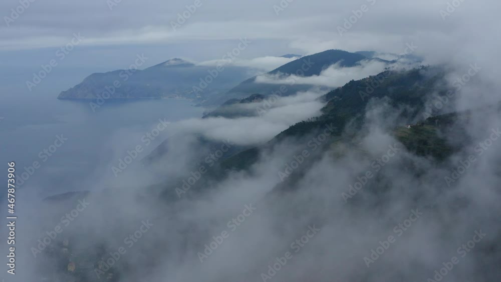 Aerial: Beautiful Scenery Of Sea And Green Mountains, Drone Flying Backwards Over White Clouds - Cinque Terre, Italy Aerial: Beautiful Scenery Of Sea And Green Mountains, Drone Flying Backwards Over White Clouds - Cinque Terre, Italy