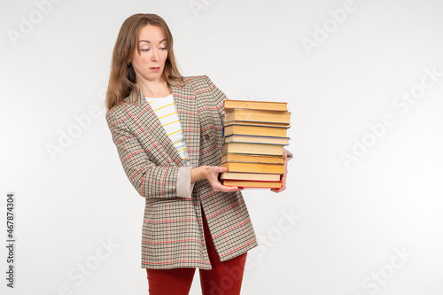 A woman demonstrates books....