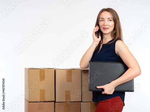 businesswoman speaks on pho...