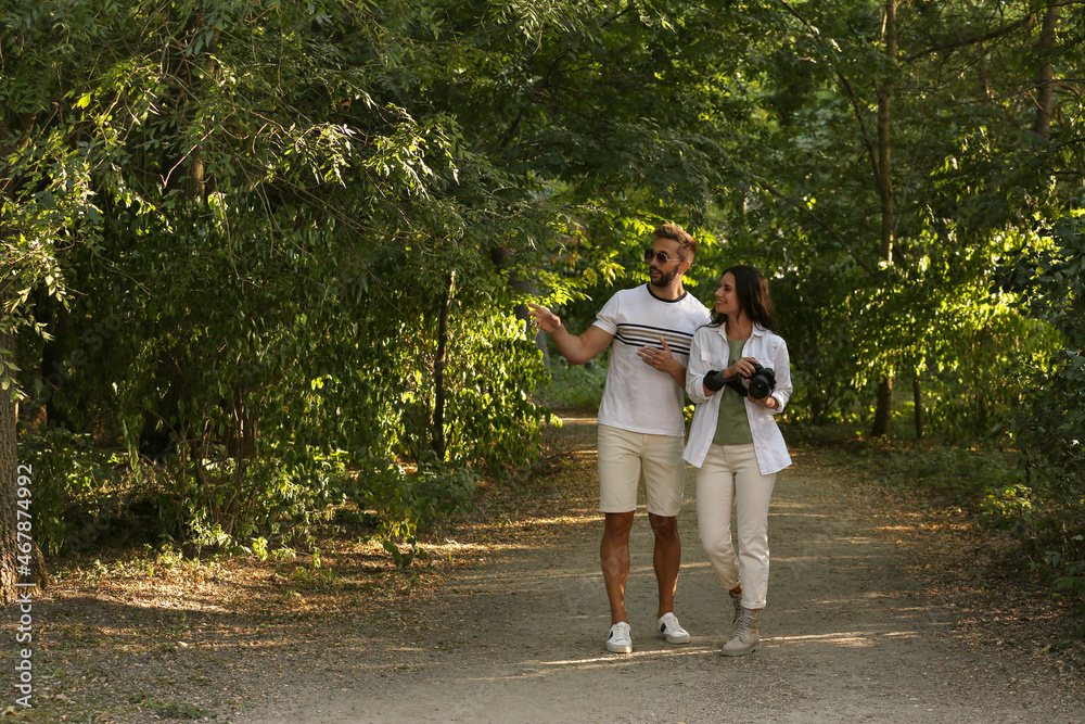 Fototapeta premium Lovely couple spending time together in nature reserve