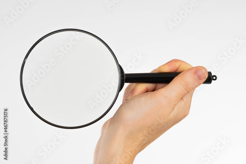 Magnifying glass hand. Fema...