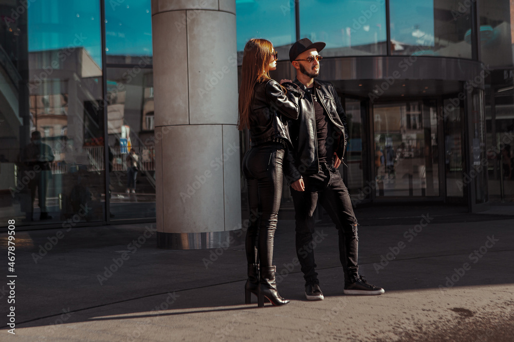 fashionable couple posing in the city