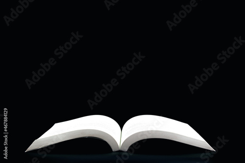 open book on black background. with copy space