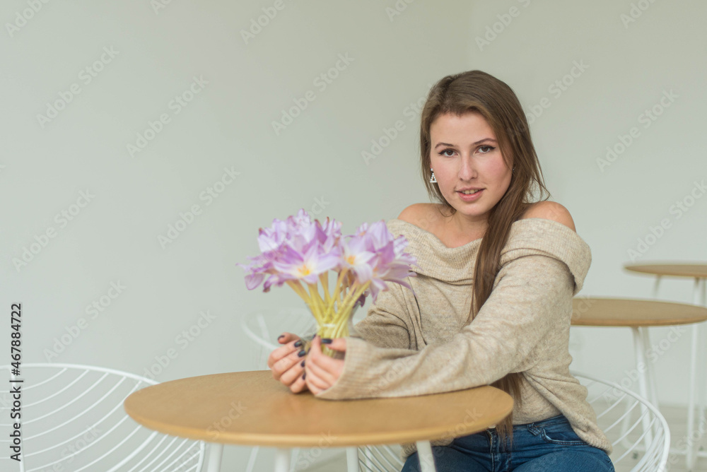 Beautiful Young Woman Waiting for a dating in a Restaurant. Attractive girl sitting in a diner all alone. Girl is waiting for date boyfriend on date. Concept lifestyle and relations. Beautiful Young Woman Waiting for a dating in a Restaurant. Attractive girl sitting in a diner all alone. Girl is waiting for date boyfriend on date. Concept lifestyle and relations.