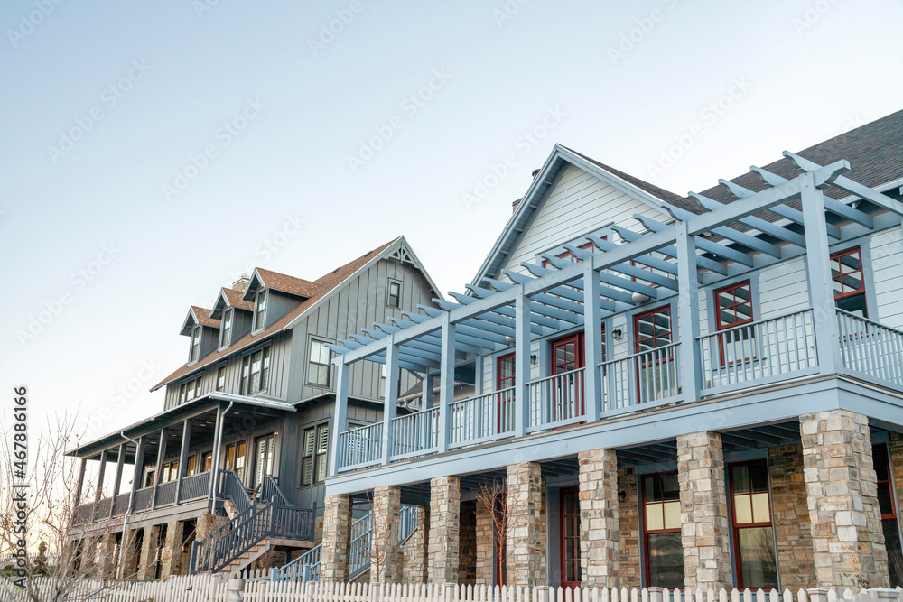 Low angle view of two luxurious houses against the clear sky Low angle view of two luxurious houses against the clear sky