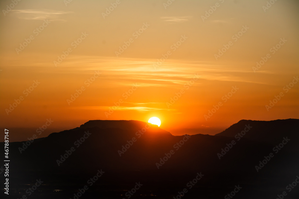 The sun was setting on the edge of the ridge Mountain. sunset