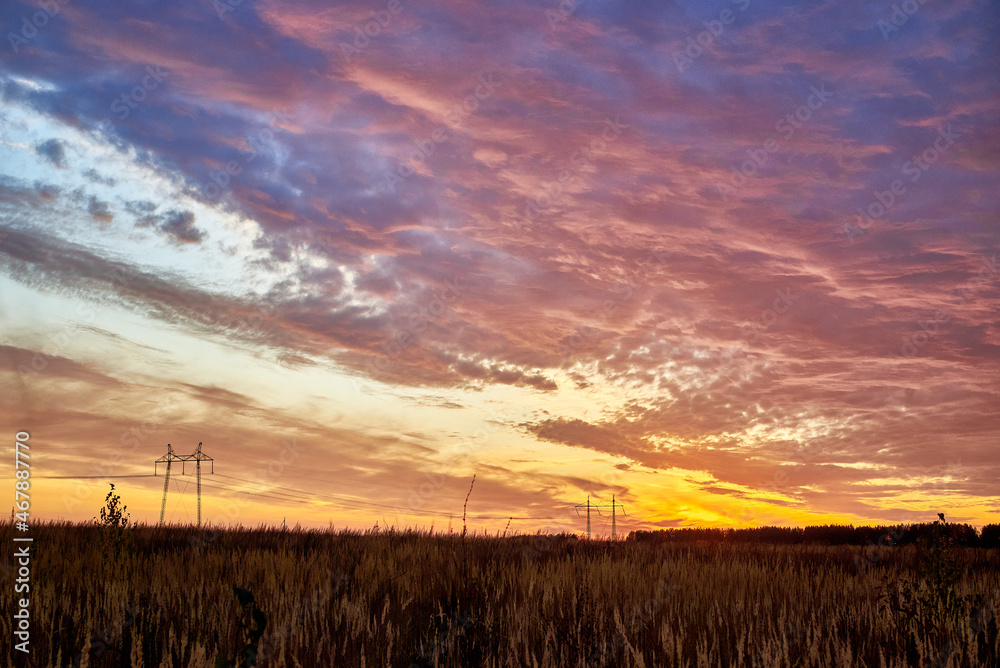 Fototapeta premium Bright beautiful autumn sunset. Rural landscape.