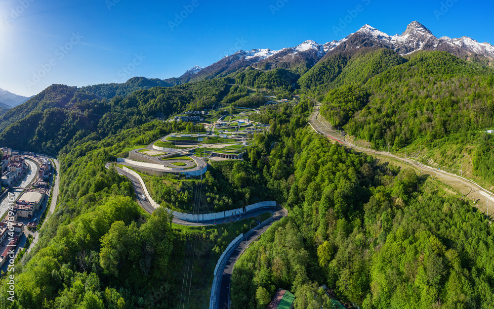 North Caucasus. Rosa Khutor Ski Resort. Serpentine road to the mountain resort. Aerial view.