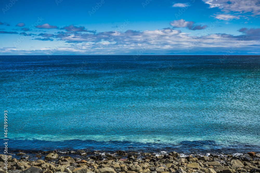View on the turquoise waters of St Lawrence river in Godbout, a small village of Cote Nord, in Quebec (Canada) View on the turquoise waters of St Lawrence river in Godbout, a small village of Cote Nord, in Quebec (Canada)