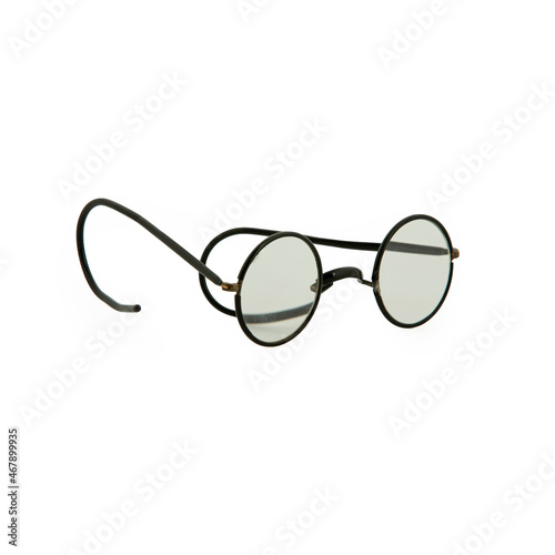 Vintage round eyeglasses on white background .