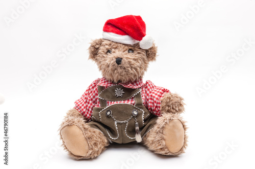 Teddybär mit Lederhose und Weihanchtsmütze