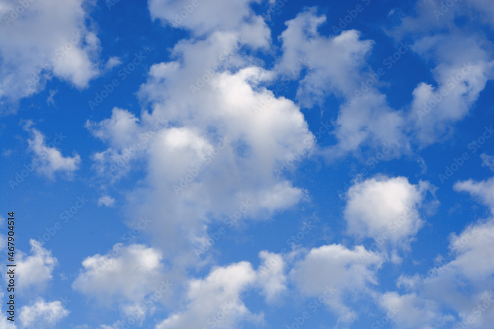 White clouds on a blue sky background