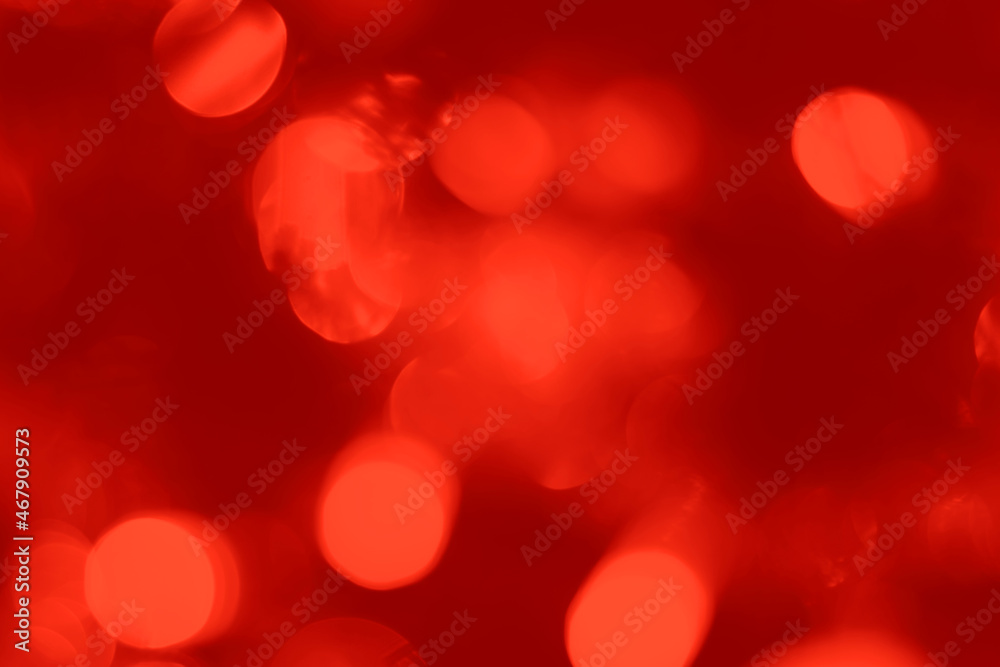 Blurred lights red background. Abstract bokeh with soft light. Trendy color