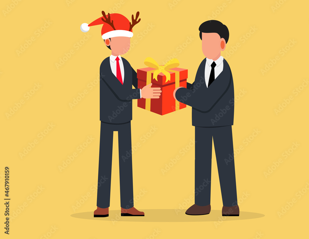 Obraz premium Businessman in a santa claus hat giving a gift to a colleague.Corporate worker Christmas and New Year congratulations.
