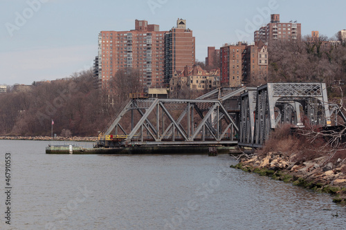 the Spuyten Duyvil Bridge, railroad swing bridge for trains connecting the Bronx to Manhattan over the Spuyten Duyvil Creek and Hudson River, here with swing section out preparing for boat crossing photo