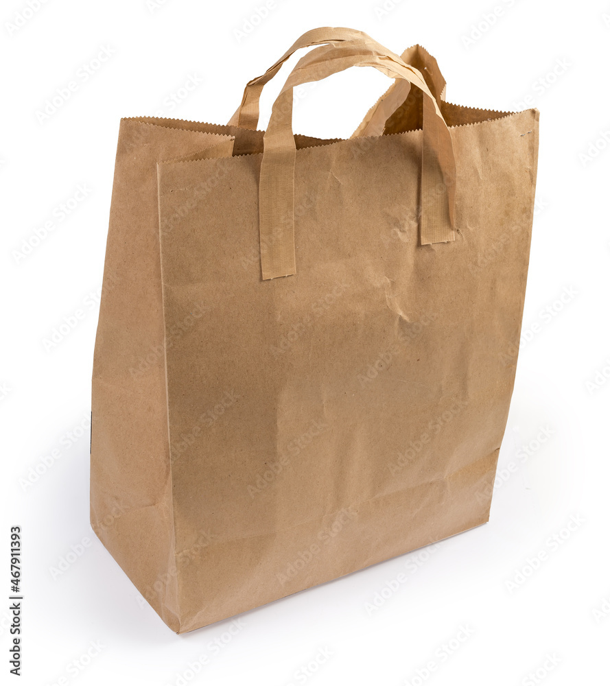 Brown packaging paper bag with paper handles on white background Brown packaging paper bag with paper handles on white background