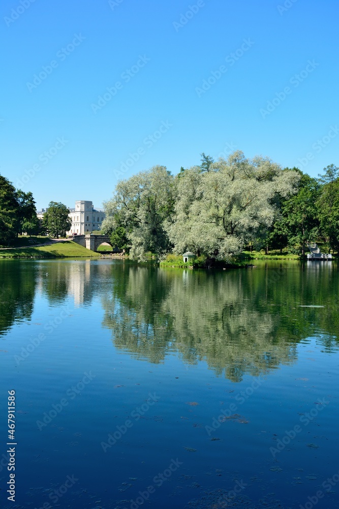 View over the White Lake with Gatchina Palace and Karpin Bridge at the back in Gatchina, near Saint Petersburg, Russia View over the White Lake with Gatchina Palace and Karpin Bridge at the back in Gatchina, near Saint Petersburg, Russia