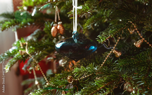 Blue glass toy on a christmas tree
