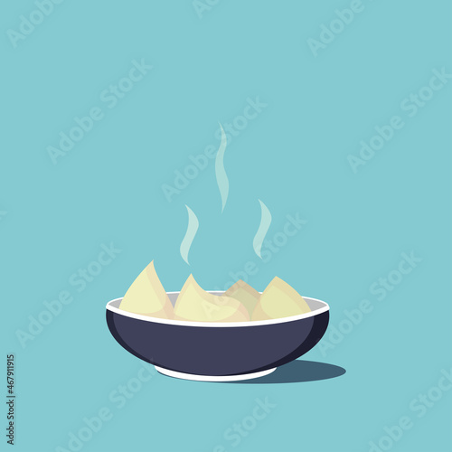 The dumplings are on the plate. Steam comes from the dumplings. The plate casts a shadow. 
