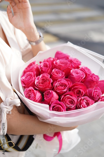 Bouquet of pink roses in hands