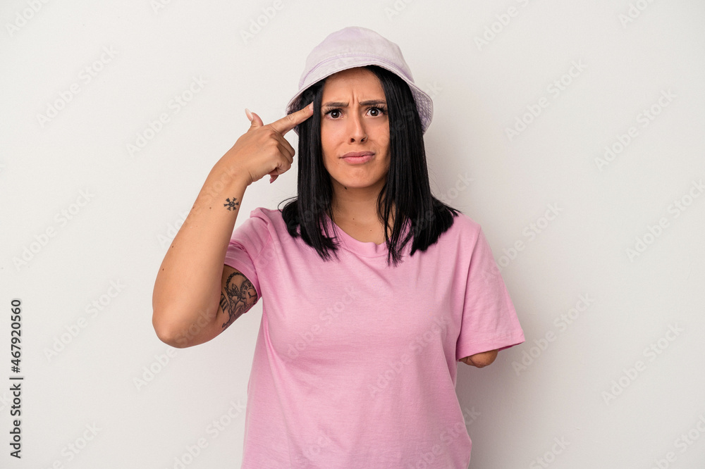 Young caucasian woman with one arm isolated on white background showing a disappointment gesture with forefinger. Young caucasian woman with one arm isolated on white background showing a disappointment gesture with forefinger.