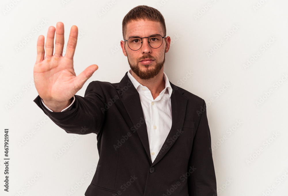 Young business caucasian man isolated on white background standing with outstretched hand showing stop sign, preventing you. Young business caucasian man isolated on white background standing with outstretched hand showing stop sign, preventing you.