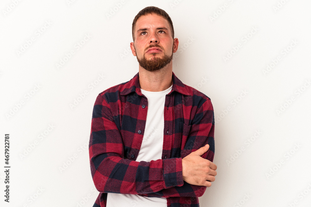 Young caucasian man with diastema isolated on white background tired of a repetitive task. Young caucasian man with diastema isolated on white background tired of a repetitive task.