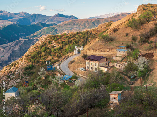 Mountain village in spring. Shamil gate Upper Gunib in Dagestan. Gunib fortress is a histori photo