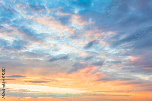 Sky Background - pastel colors of light clouds in sanset sundown sky © Taiga