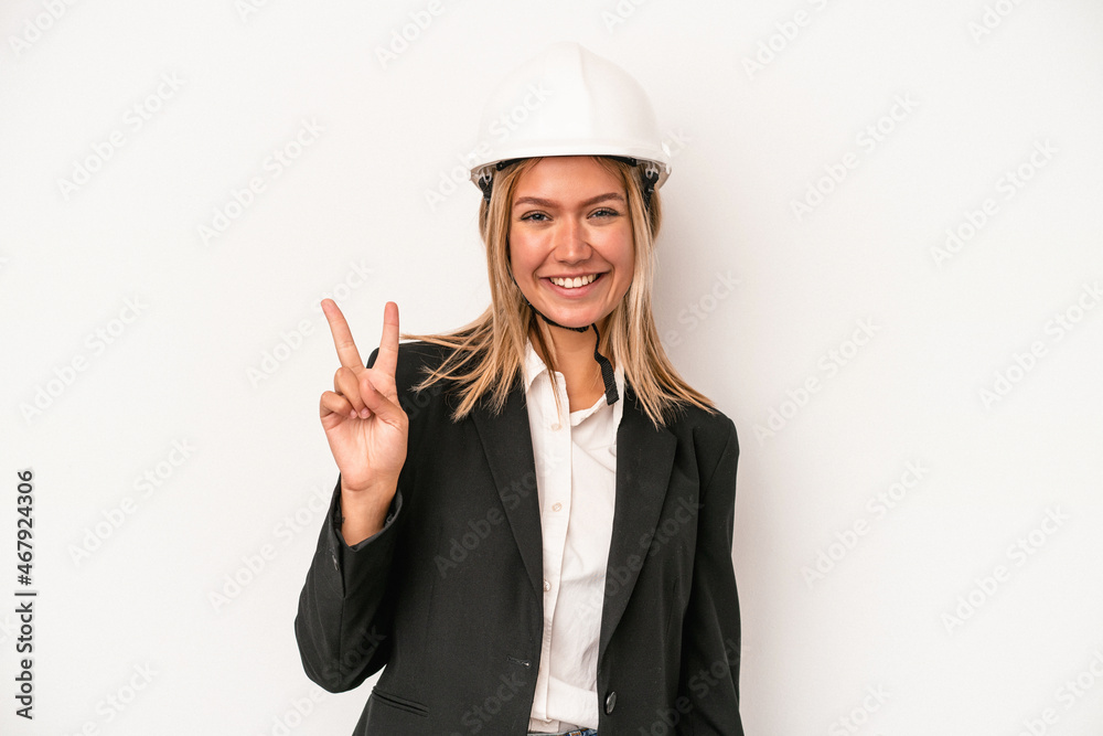 Young caucasian architect woman wearing a helmet isolated on white background showing number two with fingers. Young caucasian architect woman wearing a helmet isolated on white background showing number two with fingers.