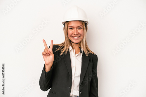 Young caucasian architect woman wearing a helmet isolated on white background showing number two with fingers.