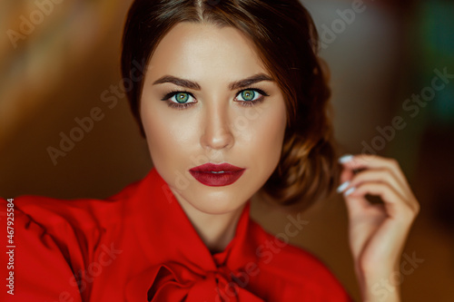 portrait of a young European woman with red lips and bright clothes