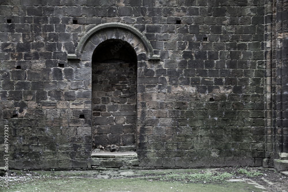 Fototapeta premium Bricked up doorway in an old gothic building