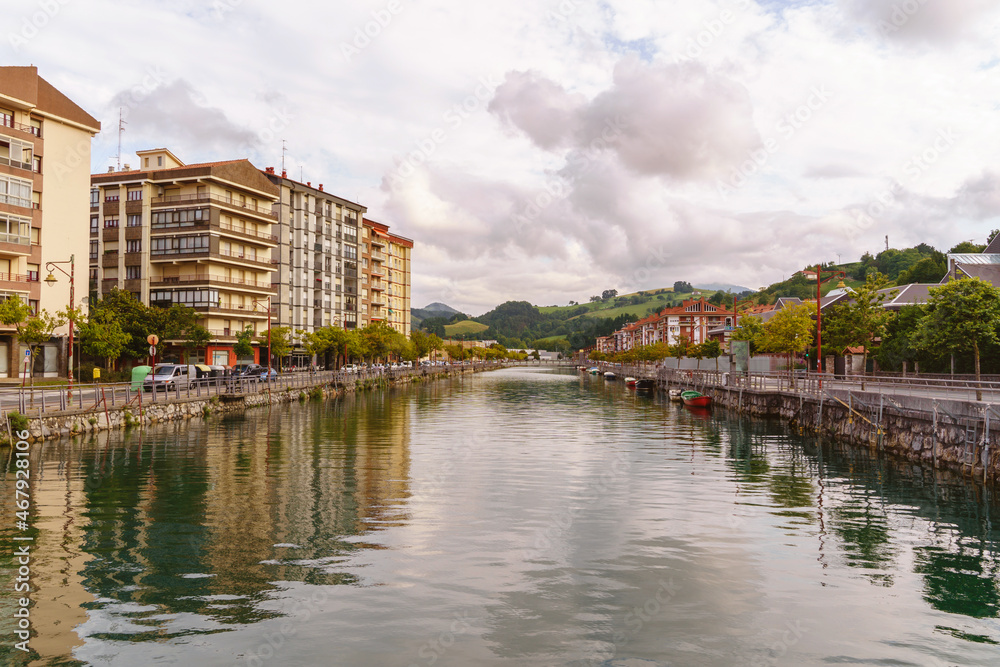 Panoramic view of Narrondo river in the spanish city of Zumaia. Horizontal view of vasque city landscape with river. Travel destination in Spain.