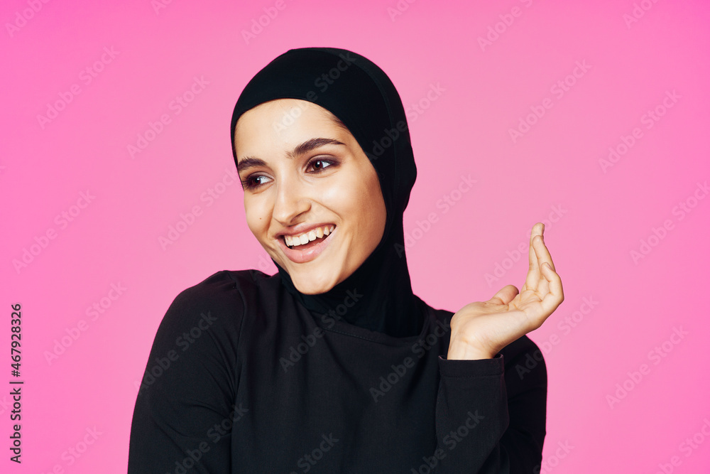 cheerful muslim woman in black hijab posing fashion pink background cheerful muslim woman in black hijab posing fashion pink background