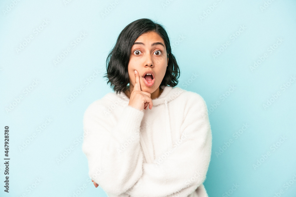 Young latin woman isolated on blue background having some great idea, concept of creativity. Young latin woman isolated on blue background having some great idea, concept of creativity.