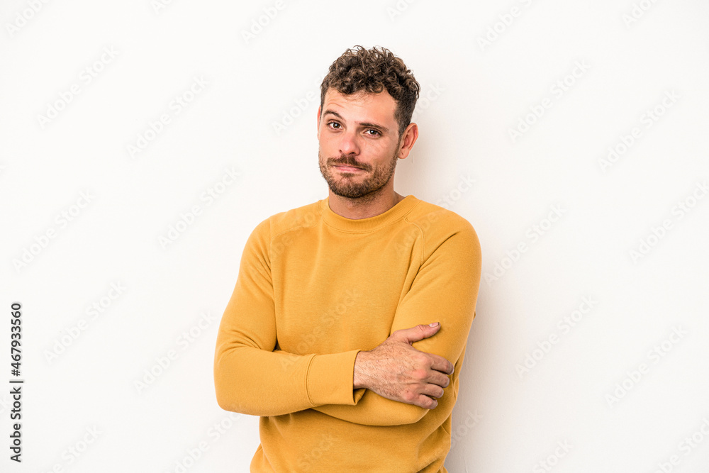 Young caucasian man isolated on white background unhappy looking in camera with sarcastic expression. Young caucasian man isolated on white background unhappy looking in camera with sarcastic expression.