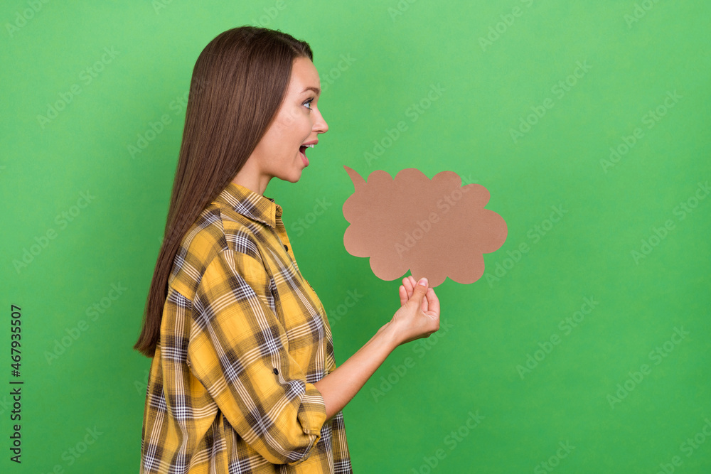 Fototapeta premium Profile photo of satisfied young lady hold cloud shape look empty space isolated on green color background
